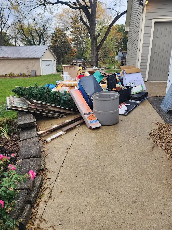 Dumpster being loaded with debris for Residential Dumpster Rental in Muleshoe